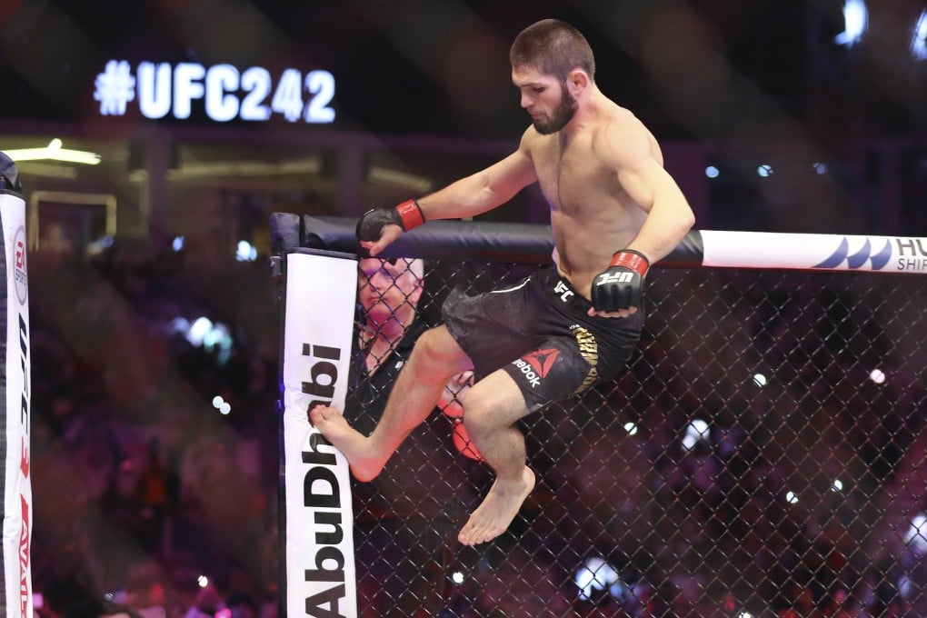 Khabib Nurmagomedov vaults the Octagon to celebrate his victory against Dustin Poirier at UFC 242. Photo: AP