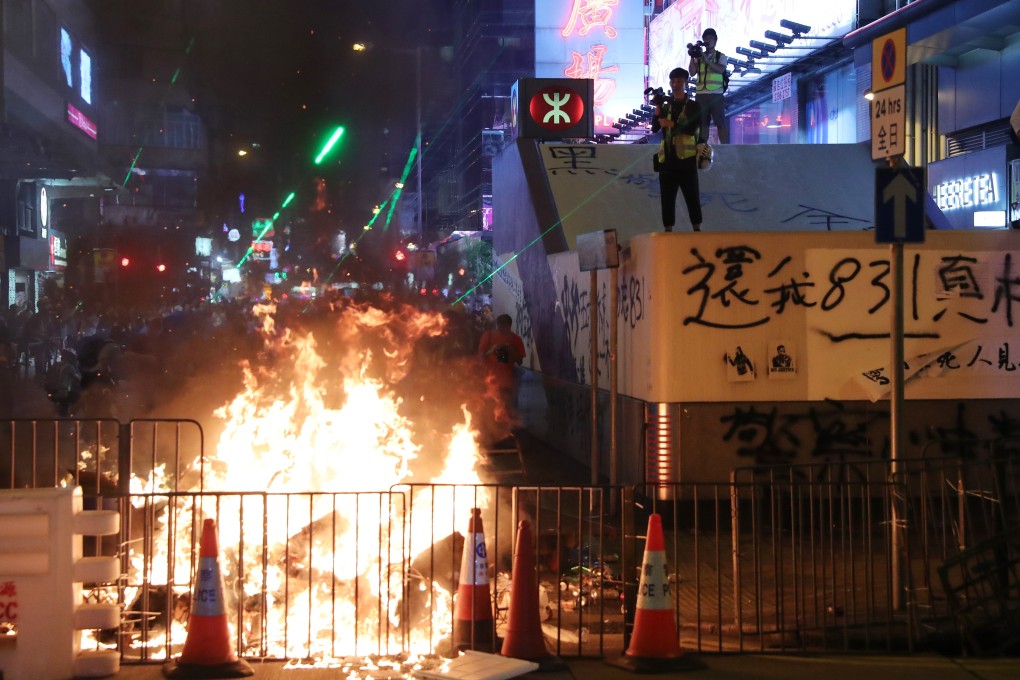 Anti-government protesters starts a fire near the Prince Edward MTR station and the Mong Kok Police Station in Prince Edward on September 7. Photo: Sam Tsang
