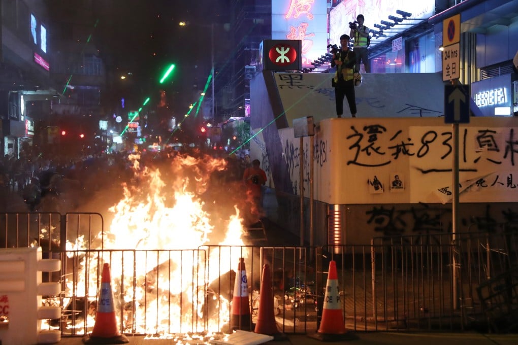 Anti-government protesters starts a fire near the Prince Edward MTR station and the Mong Kok Police Station in Prince Edward on September 7. Photo: Sam Tsang