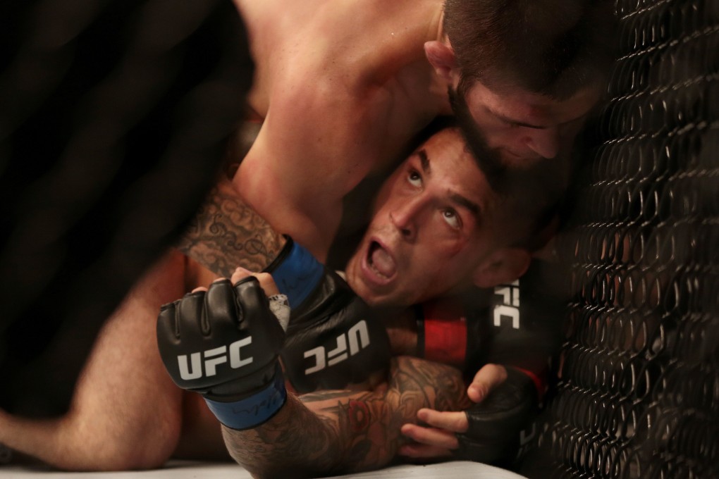 Khabib Nurmagomedov tries to choke Dustin Poirier at UFC 242. Photo: Reuters