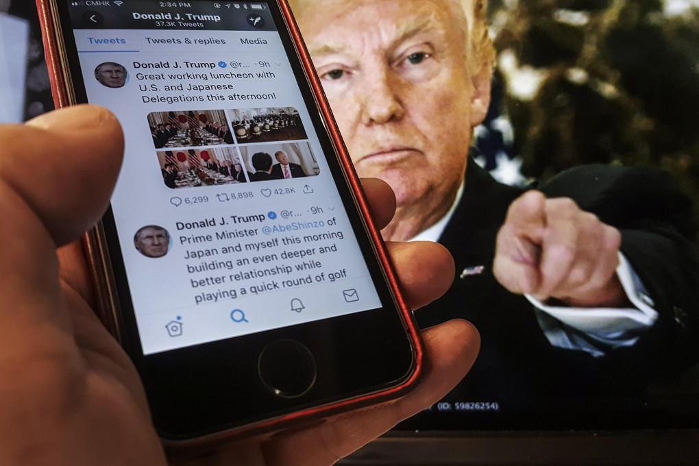 A mobile phone shows tweets sent by Donald Trump. Photo: SCMP