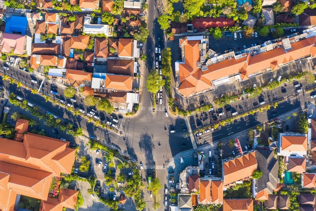 A top down view of a crowded road intersection in the Sanur area of Denpasar city in Bali, Indonesia. Photo: Shutterstock