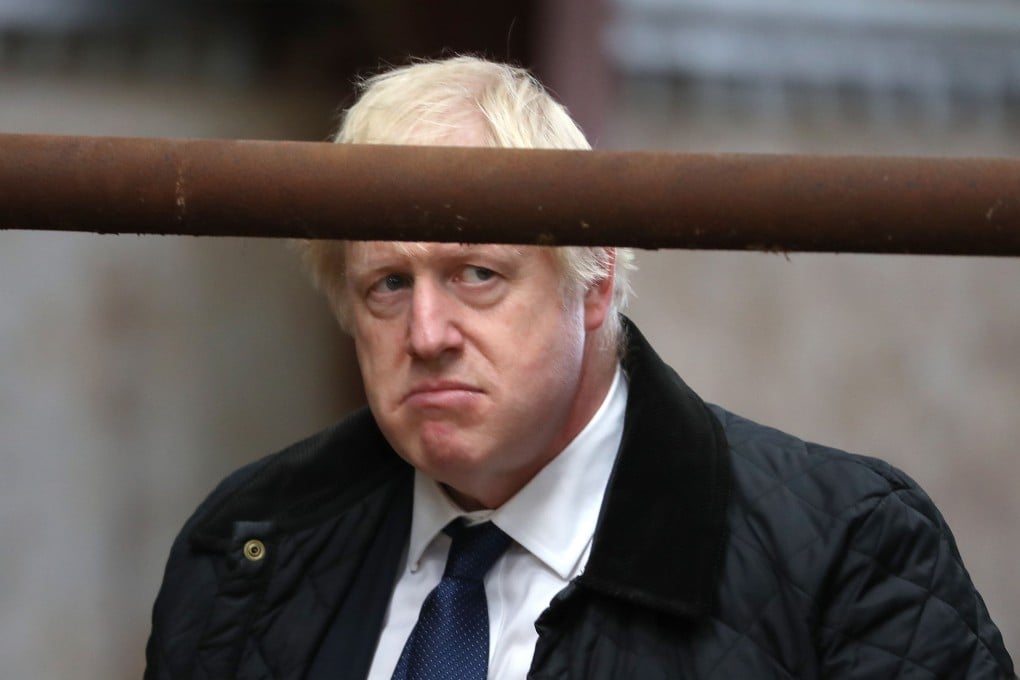 Britain's Prime Minister Boris Johnson visits Darnford Farm in Banchory near Aberdeen in Scotland on Friday. Photo: AFP