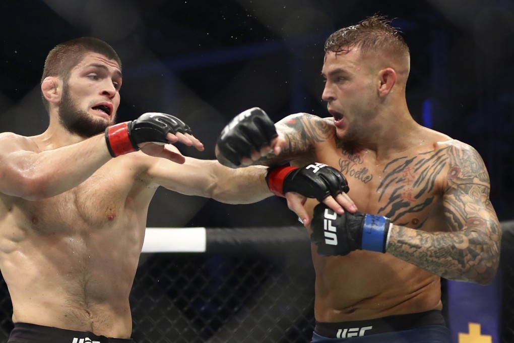 Dustin Poirier throws a punch at Khabib Nurmagomedov. Photo: AP