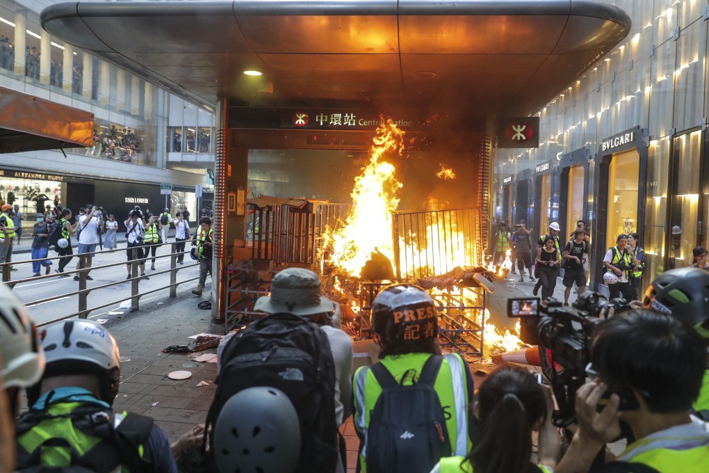 Protesters start a fire at an entrance of Central MTR Station on September 8. Photo: Edmond So