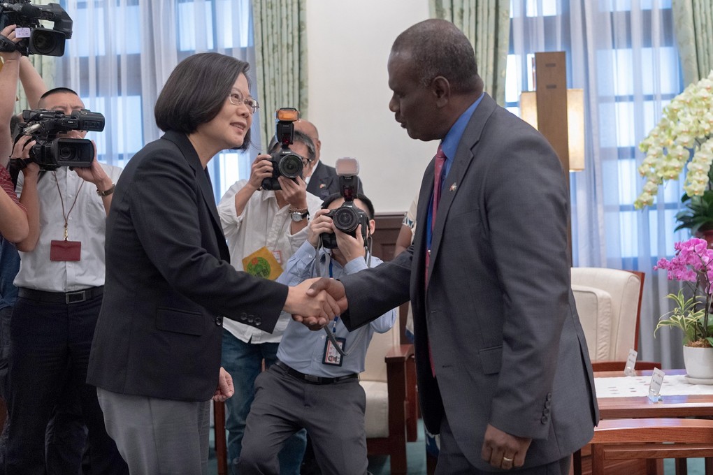 Taiwanese President Tsai Ing-wen greets Solomon Islands Foreign Minister Jeremiah Manele in Taipei on Monday. Photo: EPA-EFE
