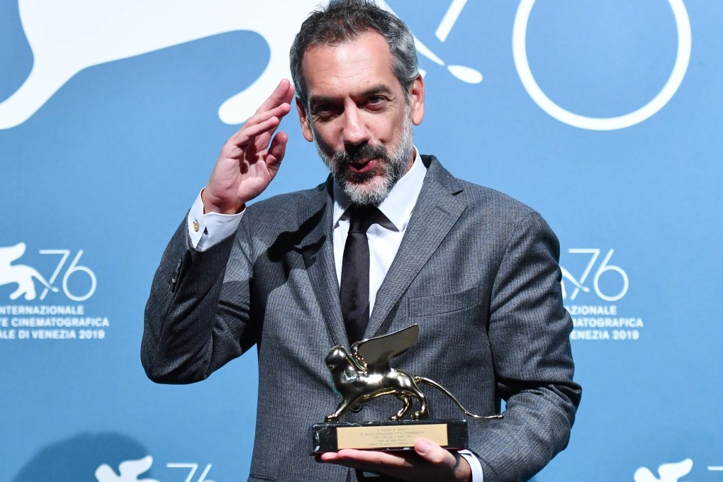 US director Todd Phillips holds the Golden Lion award for best film he won for Joker at the Venice International Film Festival this month. Photo: AFP