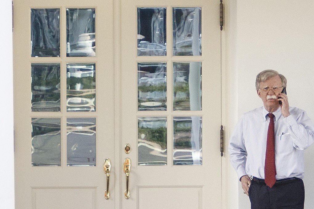 John Bolton, national security adviser, uses a mobile phone outside the West Wing of the White House on Tuesday. Photo: Bloomberg