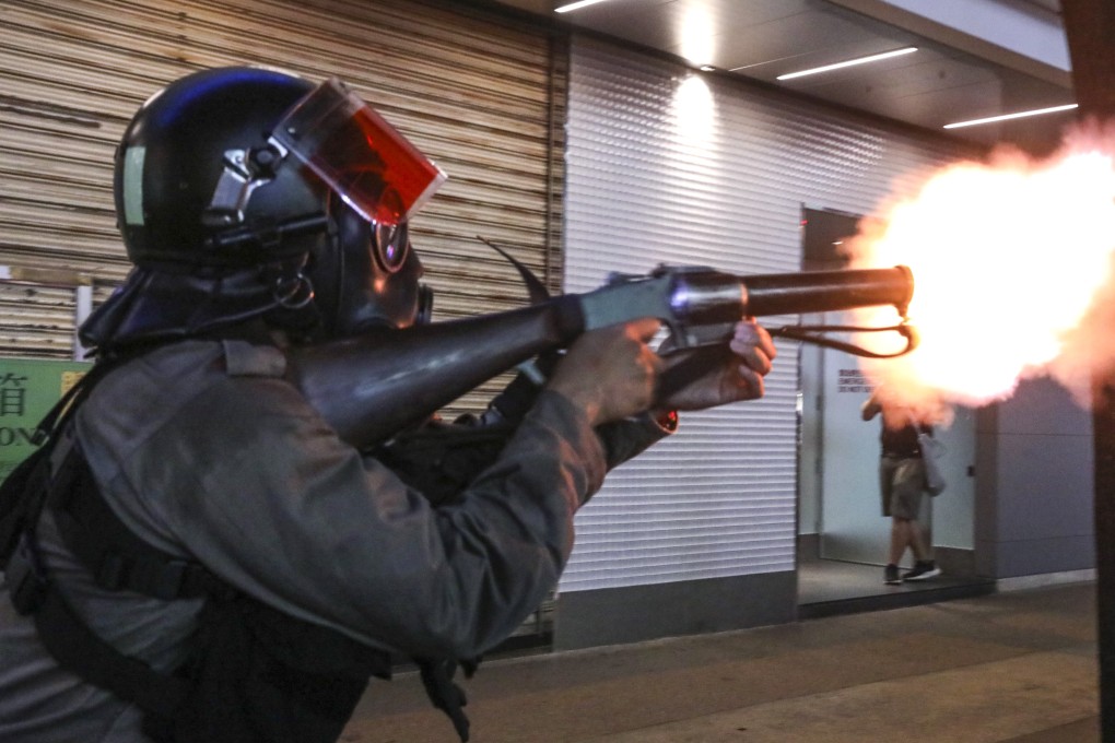 Riot police fire tear gas during unrest in Causeway Bay, Hong Kong. Photo: K.Y. Cheng