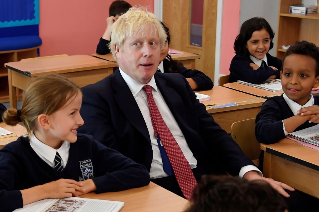 Britain's Prime Minister Boris Johnson attends a class during his visit to Pimlico Primary school in London on Tuesday. Photo: AFP