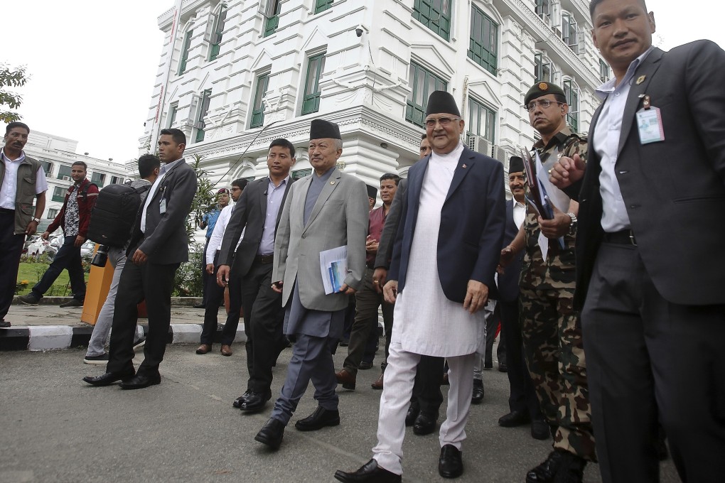 Prime Minister Khadga Prasad Oli, centre right, leaves after virtually inaugurating the Nepal-India cross border petroleum pipeline through video conference. Photo: AP