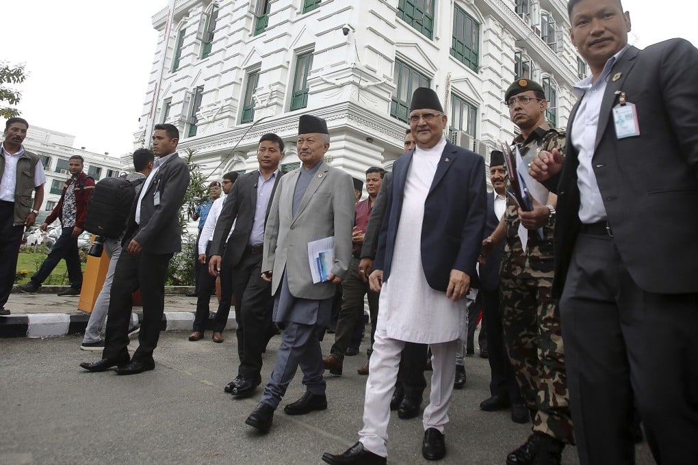 Prime Minister Khadga Prasad Oli, centre right, leaves after virtually inaugurating the Nepal-India cross border petroleum pipeline through video conference. Photo: AP