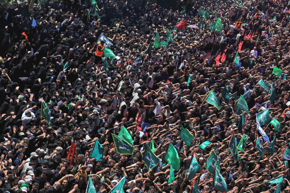Iraqi Shiite Muslims take part in a mourning procession to mark Ashura in the holy city of Karbala on Tuesday. Photo: AFP