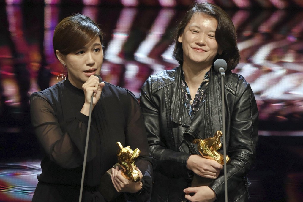 Taiwanese director Fu Yue (left) delivers her acceptance speech next to producer Hong Ting-yi after winning the best documentary prize at the 2018 Golden Horse Awards. In her speech she said she wanted the world to recognise the island as an independent country. Photo: AP