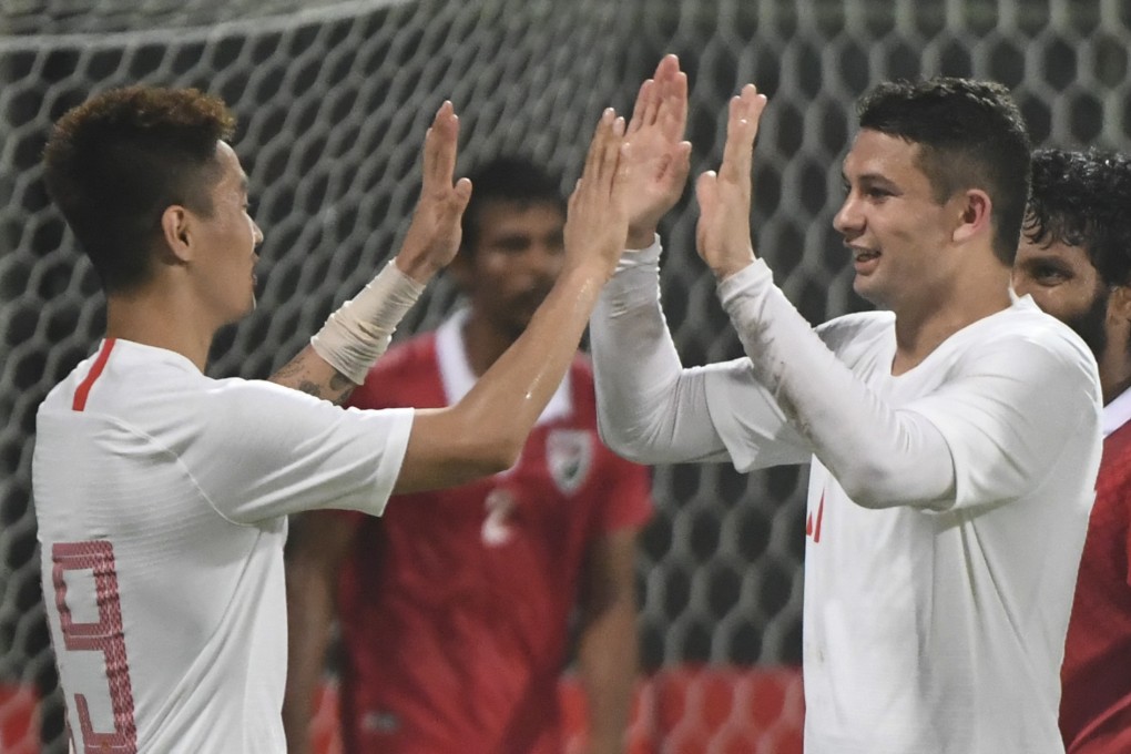 Elkeson (now known as Ai Kesen) and Wei Shihao (right) celebrate China’s victory over Maldives in Male. Photos: Xinhua