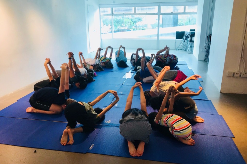 A yoga session during a Mum and Child Empowerment Dayfest.