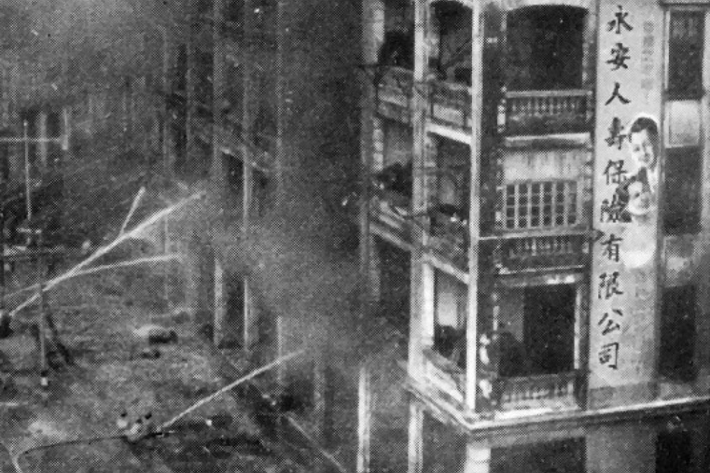Firefighters struggle to control the blaze at the Wing On godown, in 1948.