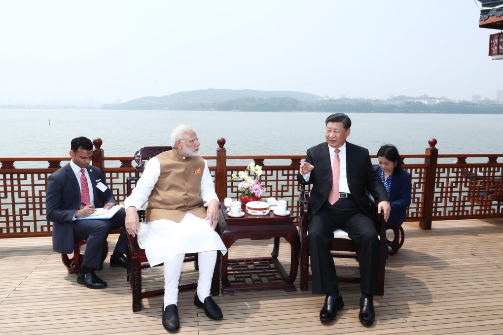 Visiting Indian Prime Minister Narendra Modi speaks to Chinese President Xi Jinping in Wuhan, the capital of Hubei province, in April 2018. The informal summit drew a line under a damaging border dispute a year earlier and signalled an intention on both sides to work together. Photo: Xinhua