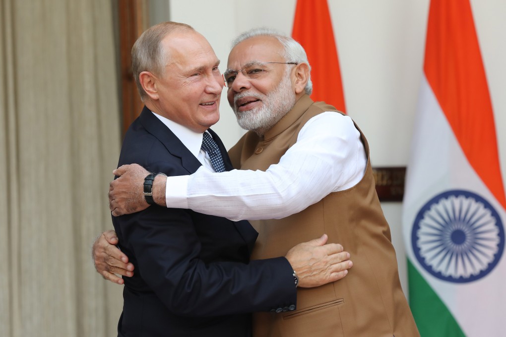 Russian President Vladimir Putin (left) and Indian Prime Minister Narendra Modi greet each other warmly, during Putin’s visit to New Delhi last year. Photo: EPA-EFE