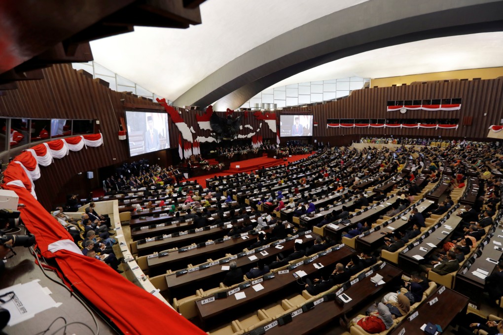 Indonesian members of parliament listen to President Joko Widodo delivering a speech ahead of Independence Day in Jakarta on August 16. Photo: Reuters