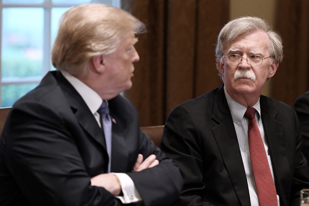 US President Donald Trump, left, and John Bolton, his former national security adviser, who was a hawk among hawks. Photo: TNS