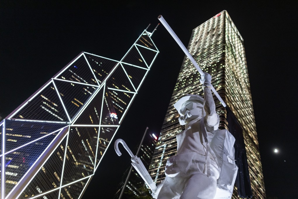 Hong Kong’s “Lady Liberty” statue stands in front of the Bank of China Tower (left) and Cheung Kong Center during a rally at Chater Garden in Central on September 6. Photo: Bloomberg