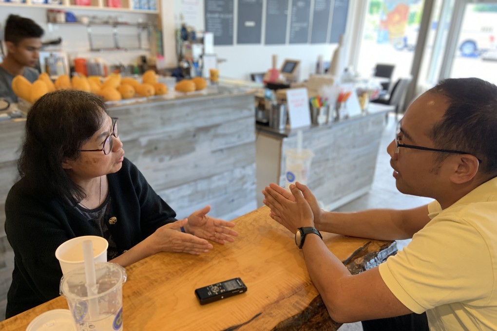 Hong Kong democracy activist Fenella Sung and pro-China protester Victor Feng discuss their differences at Bubble Queen cafe in Vancouver. Photo: Ian Young