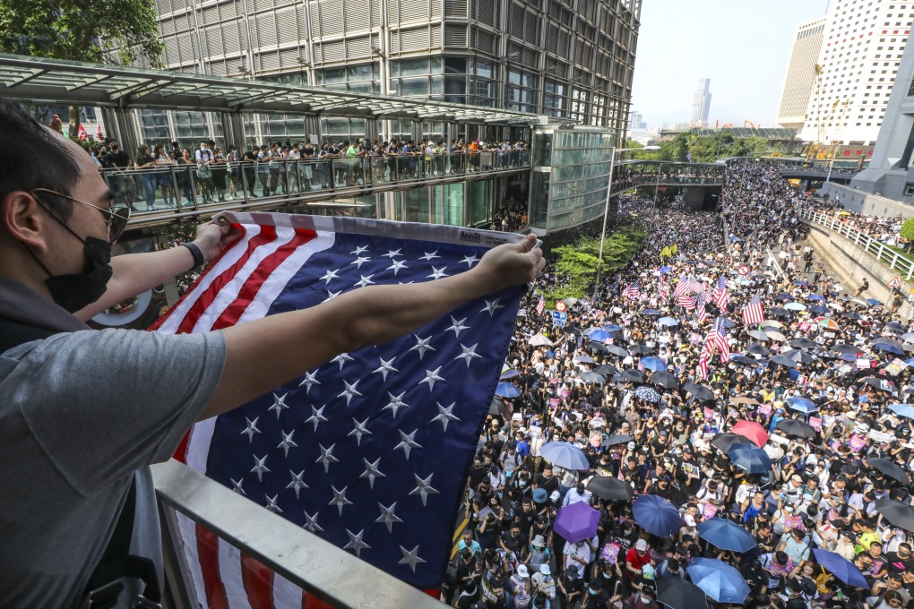 A Hong Kong protester with a US flag. Photo: Dickson Lee
