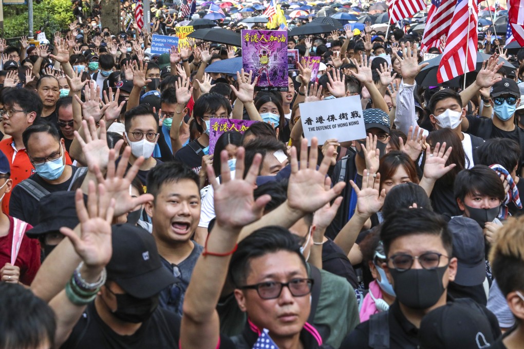 Protesters call for their five demands to be met during a September 8 march to the US consulate in Hong Kong, calling on Washington to pass an act in support of Hong Kong’s democratic development and human rights. Photo: Felix Wong
