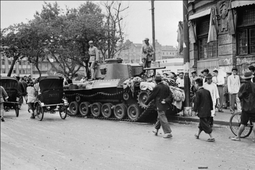 People walk by a communist tank in Shanghai in 1949. Mao Zedong could have sent the victorious People’s Liberation Army to Hong Kong then but decided against it. Photo: AFP