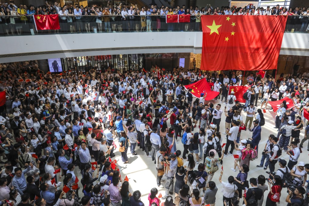 Pro-China activists appear at IFC, Central. Photo: May Tse