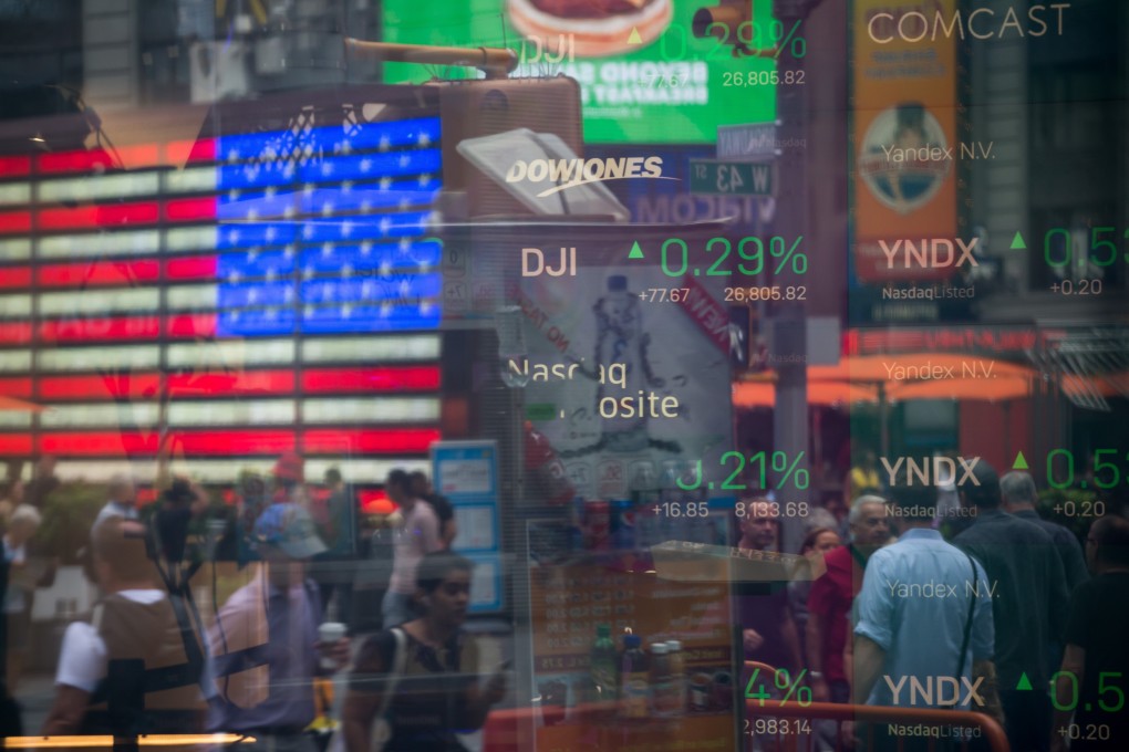 Monitors display stock market information at the Nasdaq MarketSite in Times Square, New York, on September 6. The main reason for stocks’ resilience has been policymakers’ determination to loosen monetary policy to prevent this late-cycle economic slowdown from turning into a full-blown recession. Photo: Bloomberg