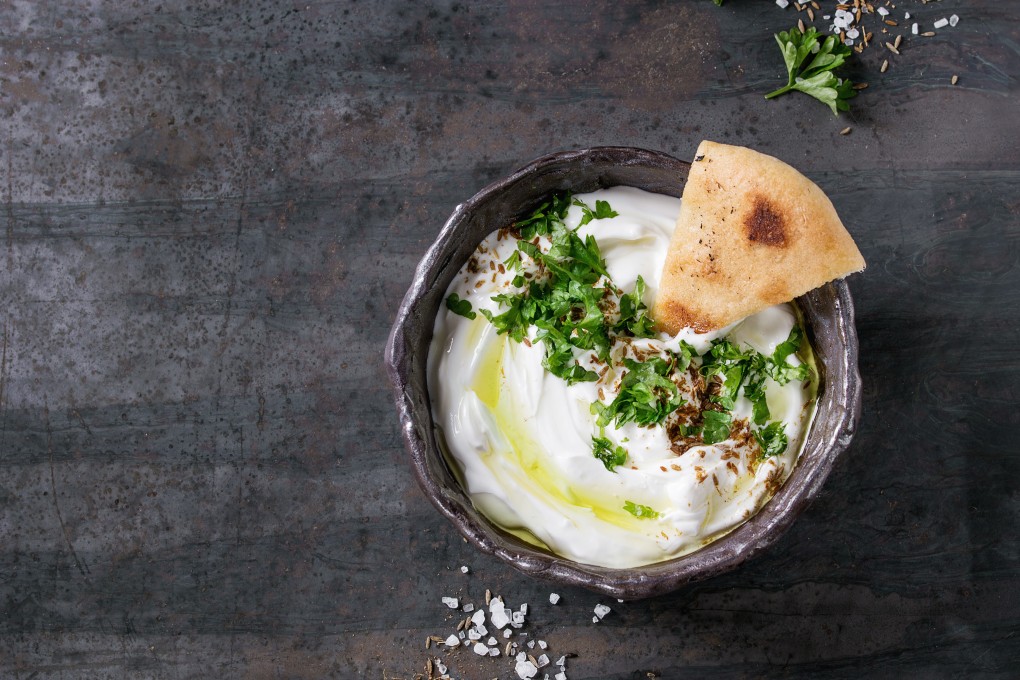 This image may be republished, Labneh with olive oil and herbs, with pita bread