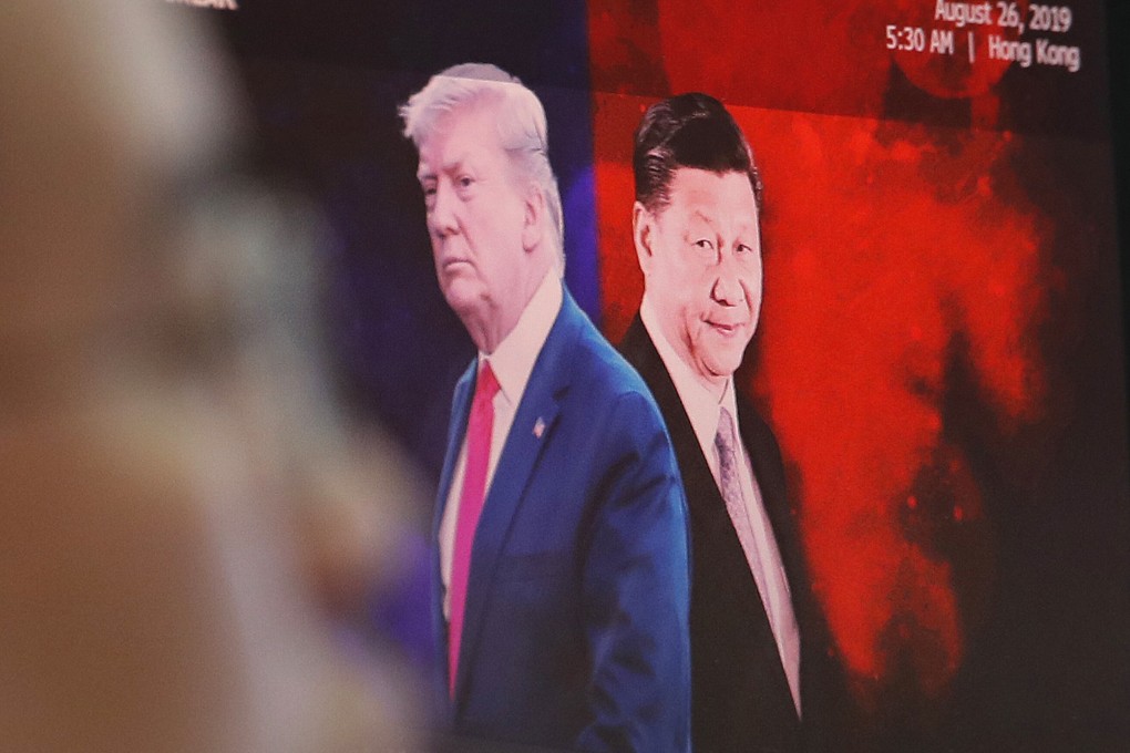 A computer screen shows images of US President Donald Trump and Chinese President Xi Jinping as a currency trader works in South Korea. Photo: AP