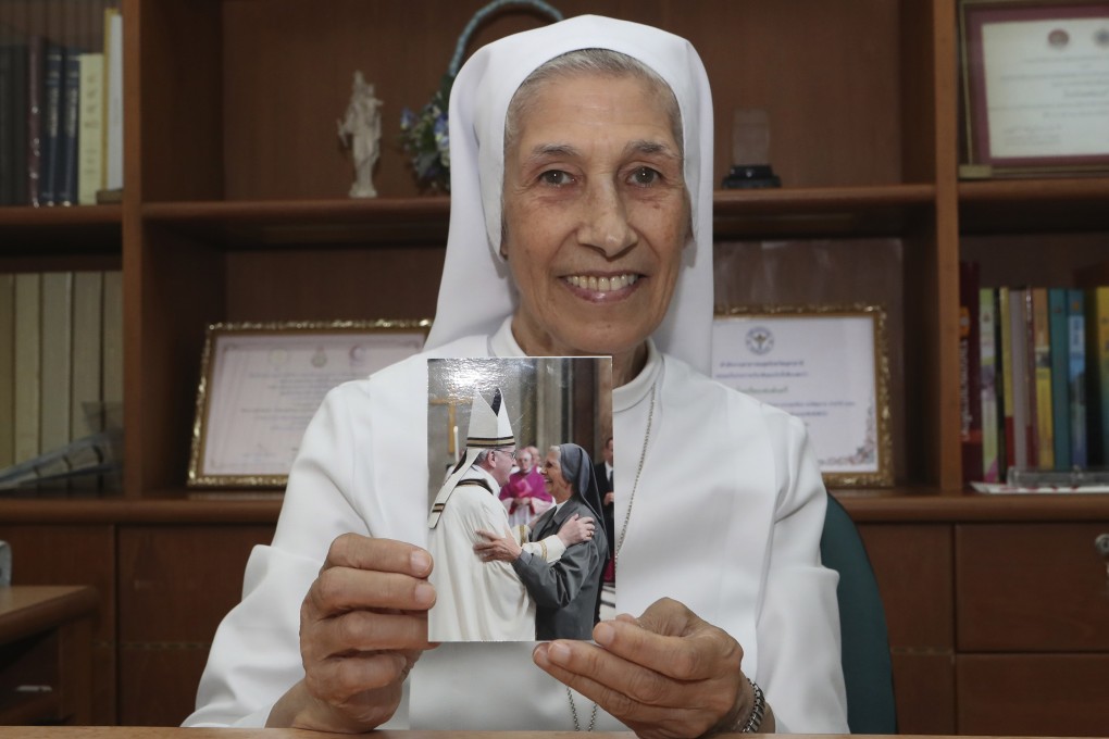 Sister Ana Rosa Sivori shows a picture taken with her second cousin Pope Francis. Photo: AP