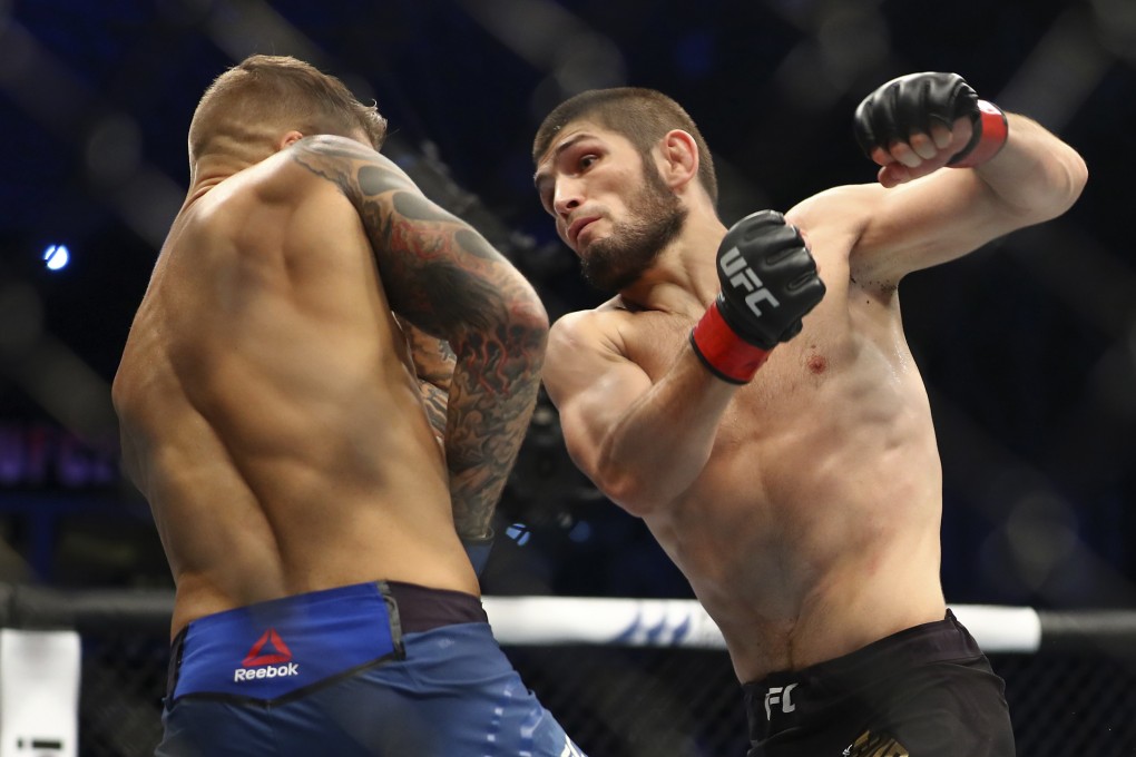 Khabib Nurmagomedov (right) throws a punch at Dustin Poirier at UFC 242. Photo: AP