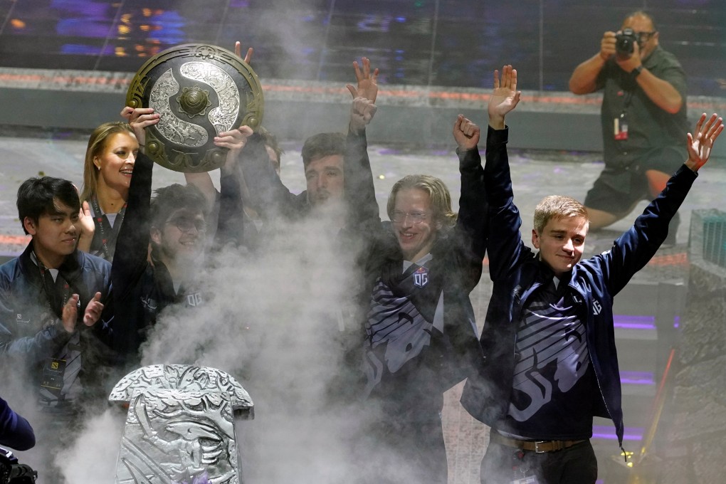 Professionals Team OG celebrate their trophy after winning The International Dota 2 World Championships in Shanghai. It’s not easy getting a piece of the e-sport action if your best game is Mahjong. Photo: ReutersThe International Dota 2 World Championships - Mercedes-Benz Arena, Shanghai, China - August 25, 2019. Team OG celebrate with the trophy after winning The International Dota 2 World Championships REUTERS/Aly Song