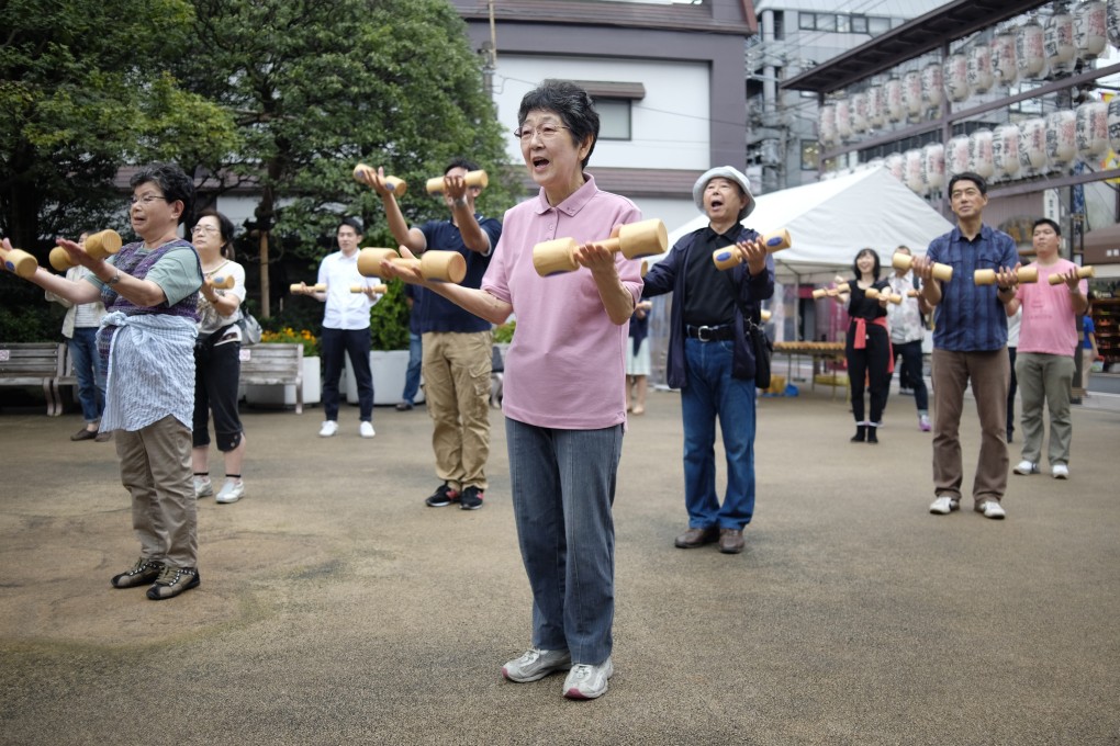 Elderly people work out in the grounds of a temple in Tokyo to celebrate Japan’s Respect for the Aged Day. Photo: AFP