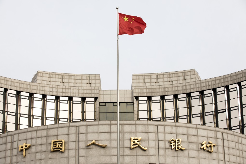 A Chinese flag flies in front of the People’s Bank of China headquarters in Beijing. Photo: Bloomberg