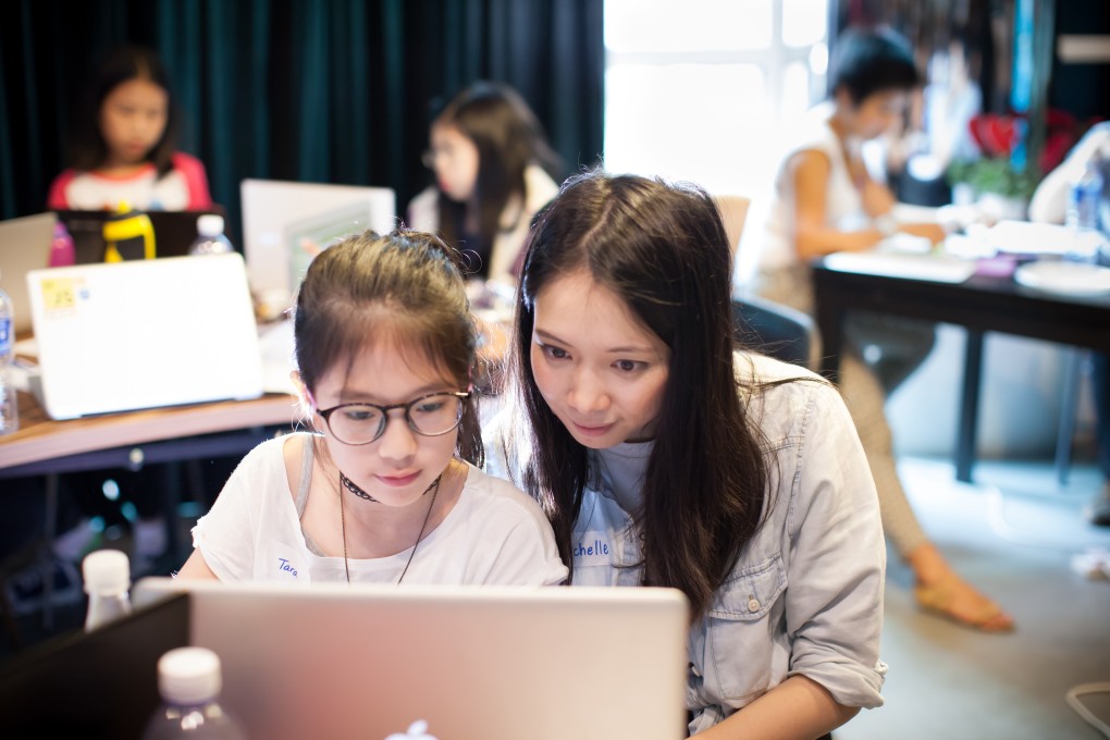 Michelle Sun, CEO of First Code Academy, with children in her coding school. Photo: Handout