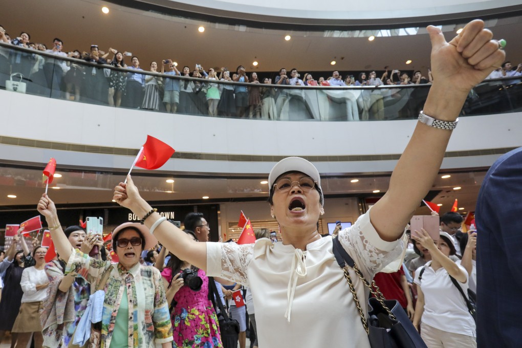 Beijing supporters demonstrate at the International Finance Centre in Central in response to anti-government protests that have hit Hong Kong. Photo: May Tse