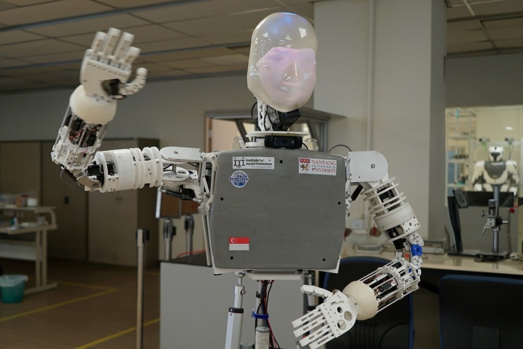 A robot named EDGAR, short for Expressions Display and Gesturing Avatar Robot, waves at the camera at a laboratory in Singapore. Photo: Reuters