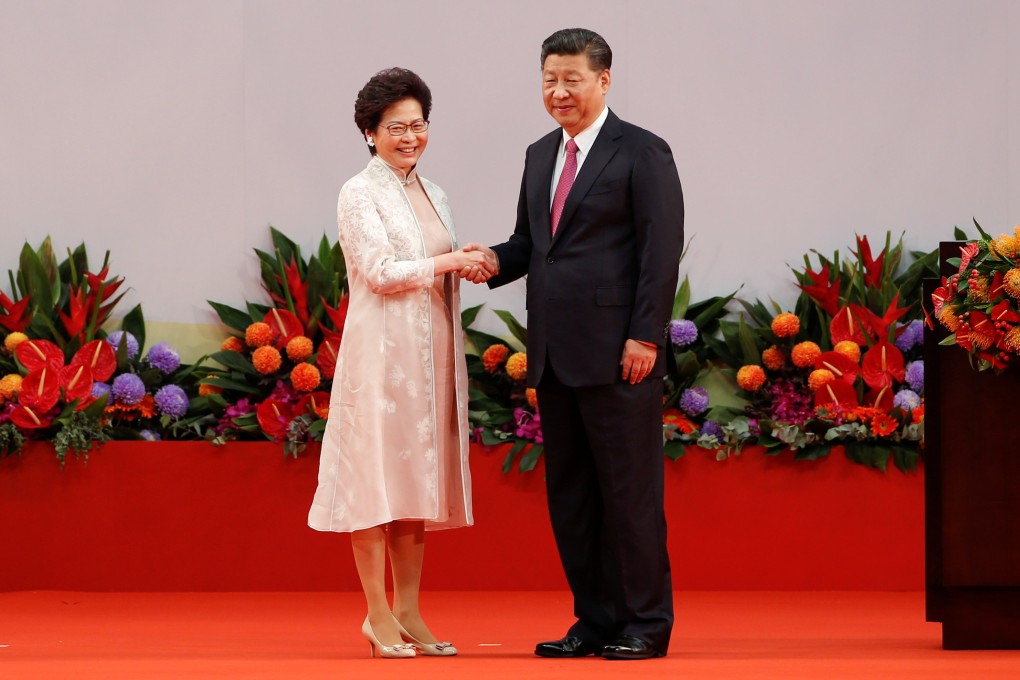 Hong Kong Chief Executive Carrie Lam shakes hands with Chinese President Xi Jinping after she took an oath of office on the 20th anniversary of the city’s handover from British to Chinese rule on July 1, 2017. Photo: Reuters