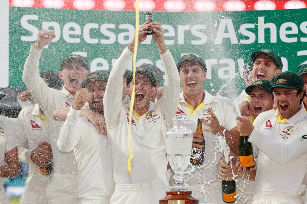 Australia’s Tim Paine holds up the Ashes urn as Australia celebrate retaining the Ashes. Photo: Reuters