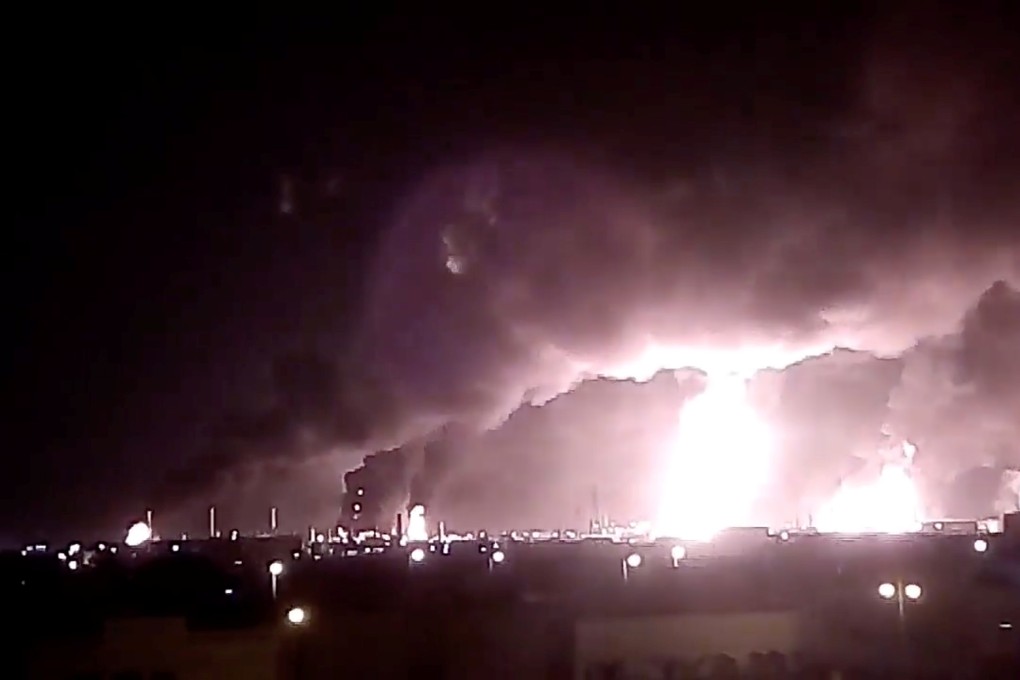 Fires burn in the distance after a drone strike by Yemen’s Iran-aligned Houthi group on Saudi company Aramco’s oil processing facilities, in Buqayq, Saudi Arabia, on Saturday. Photo: Reuters