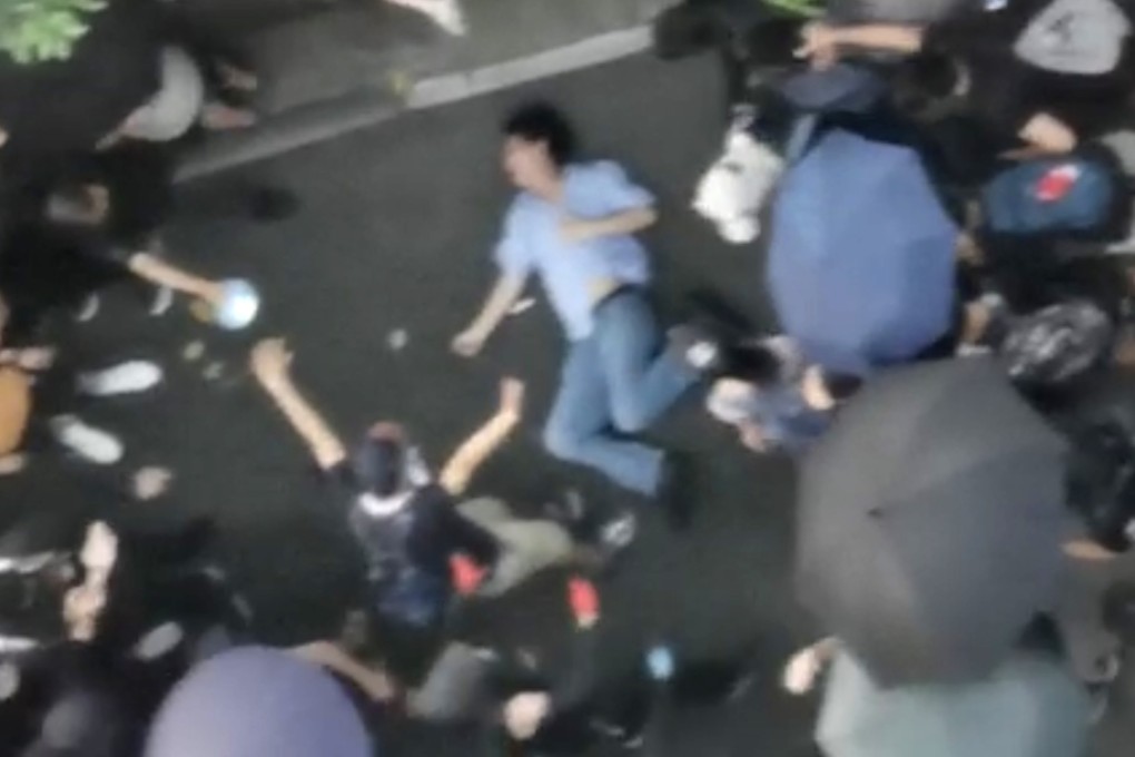 At one point, the man beaten appeared to lose consciousness and was seen lying on the ground. Photo: Handout