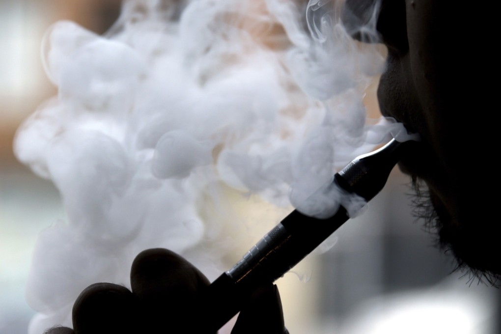 A man smokes an electronic cigarette in Chicago. Photo: AP Photo