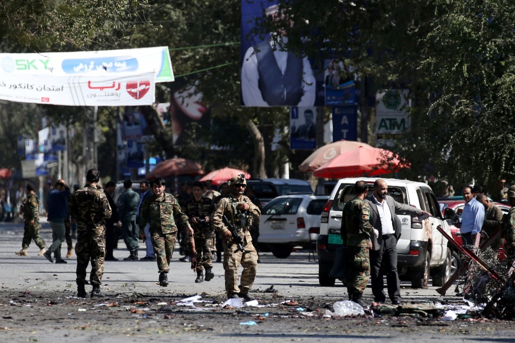 Afghan security forces inspect the site of the blast in Kabul on Tuesday. Photo: Reuters
