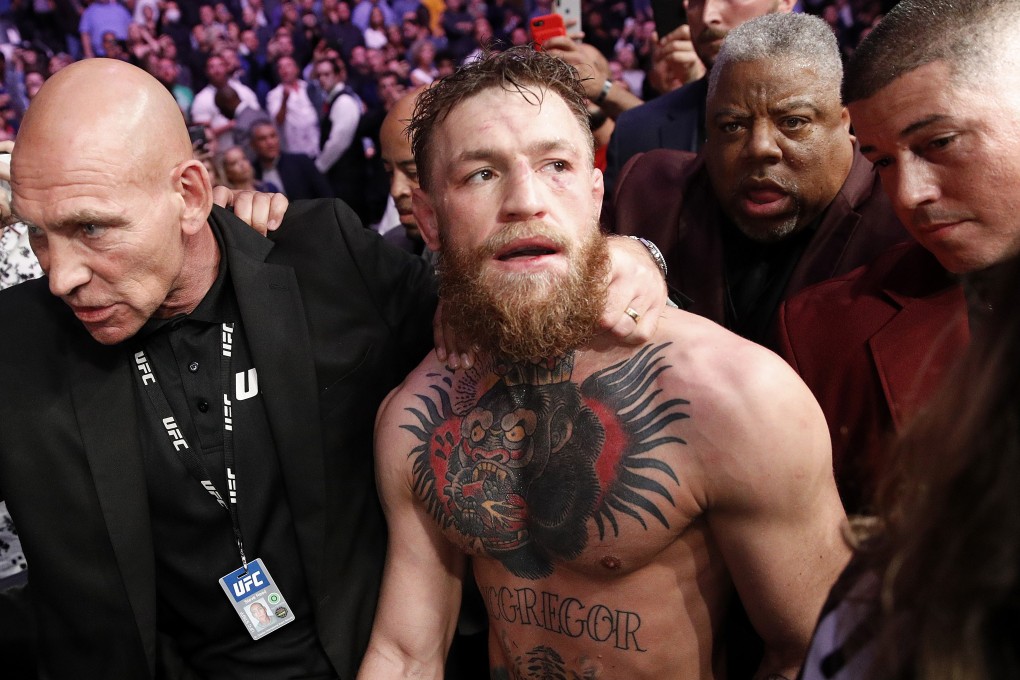 Conor McGregor is escorted from the Octagon area after fighting Khabib Nurmagomedov at UFC 229 in Las Vegas. Photo: AP