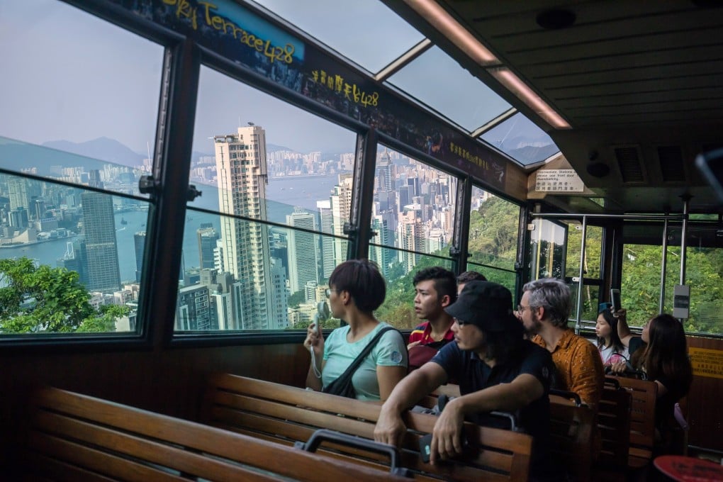 Passengers on the Peak Tram look at the Hong Kong skyline. The city’s tourism industry is experiencing its sharpest downturn since the Sars epidemic in 2003. Photo: Bloomberg